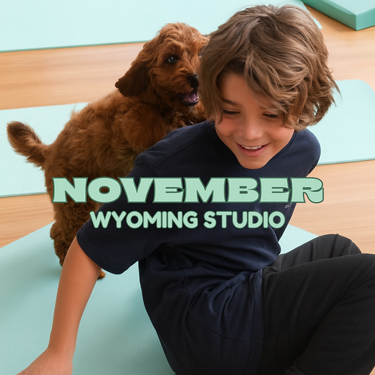Child enjoying Puppy Yoga Central Coast class with a puppy at Yogi Paws Studio in Wyoming NSW, November session.